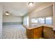 Bright kitchen with breakfast bar and natural light to adjacent room at 4718 W El Caminito Dr, Glendale, AZ 85302