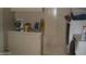 Compact laundry area with washer, dryer, and counter space, providing convenience at 4718 W El Caminito Dr, Glendale, AZ 85302