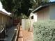 Side yard featuring decorative cacti and a charming walkway, adding to the home's appeal at 4718 W El Caminito Dr, Glendale, AZ 85302
