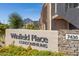 Winfield Place Condominiums community signage and address, with desert landscaping and mountain view at 7436 E Chaparral Rd # 159B, Scottsdale, AZ 85250