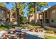 Tranquil Winfield Place courtyard with seating, picnic tables, and lush landscaping at 7436 E Chaparral Rd # 159B, Scottsdale, AZ 85250