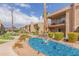 Scenic Winfield Place community featuring a tranquil water feature with lush landscaping and mountain views at 7436 E Chaparral Rd # 159B, Scottsdale, AZ 85250