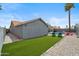 Beautiful backyard featuring artificial grass, a sparkling pool, and lounge chairs at 10010 N 64Th Ave, Glendale, AZ 85302