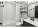 Charming bathroom featuring a shower with herringbone tile and modern black fixtures at 10010 N 64Th Ave, Glendale, AZ 85302