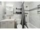 Updated bathroom featuring a tub, shower, modern vanity, and decorative shelves at 10010 N 64Th Ave, Glendale, AZ 85302