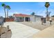 Charming home with a long driveway, tiled roof, and manicured landscaping at 10010 N 64Th Ave, Glendale, AZ 85302