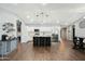 Spacious kitchen featuring white cabinets, stainless steel appliances, and an island with barstool seating at 10010 N 64Th Ave, Glendale, AZ 85302