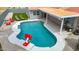 Aerial view of pool surrounded by a patio, lounge chairs, and a grilling area at 10010 N 64Th Ave, Glendale, AZ 85302