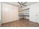 Bedroom featuring built-in storage, a desk, and neutral-toned flooring at 1014 W Hononegh Dr, Phoenix, AZ 85027