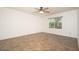 Bedroom featuring tile flooring, ceiling fan, and a large window at 1014 W Hononegh Dr, Phoenix, AZ 85027