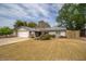 Charming single-story home features a well-manicured lawn and attached two-car garage at 1014 W Hononegh Dr, Phoenix, AZ 85027