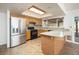Kitchen features stainless steel appliances, granite countertops and tile flooring at 1014 W Hononegh Dr, Phoenix, AZ 85027