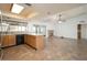 Open-concept living room features a kitchen, fireplace, and plenty of natural light at 1014 W Hononegh Dr, Phoenix, AZ 85027
