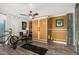 Bonus room featuring Murphy bed, ceiling fan, and plenty of natural light from the sliding glass door at 1025 E Northern Ave, Phoenix, AZ 85020