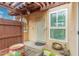 Inviting front entrance with a unique security door, window, and a cozy, private outdoor space at 1025 E Northern Ave, Phoenix, AZ 85020