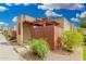 Charming home exterior with desert landscaping, wood pergola and privacy fence, enhancing curb appeal at 1025 E Northern Ave, Phoenix, AZ 85020