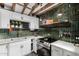 Well-lit kitchen with white cabinetry, modern appliances, and stylish fixtures at 1025 E Northern Ave, Phoenix, AZ 85020