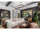 Stylish living room boasts modern decor, a cozy sofa and a unique chandelier at 1025 E Northern Ave, Phoenix, AZ 85020