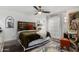 Serene main bedroom with a decorative headboard, ceiling fan and stylish furnishings at 1025 E Northern Ave, Phoenix, AZ 85020