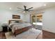 Bright main bedroom with sliding glass doors, natural light, and access to the outdoor patio at 10896 N 105Th Way, Scottsdale, AZ 85259
