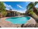 Beautiful pool with safety fence complemented by lush landscaping at 10896 N 105Th Way, Scottsdale, AZ 85259