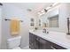 Clean bathroom with large mirror, vanity, and updated fixtures at 1216 E Ormondo Way, Phoenix, AZ 85014