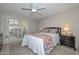 Bright bedroom with access to private patio and an overhead ceiling fan at 1216 E Ormondo Way, Phoenix, AZ 85014