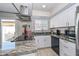 Modern kitchen featuring sleek countertops, stainless steel appliances, and ample cabinet space at 1216 E Ormondo Way, Phoenix, AZ 85014