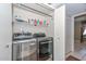 Laundry room with modern washer and dryer and storage shelves at 1216 E Ormondo Way, Phoenix, AZ 85014