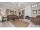 Spacious living room with a cozy fireplace and natural light at 1216 E Ormondo Way, Phoenix, AZ 85014