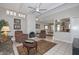 Cozy living room with fireplace, tile flooring, and access to the kitchen and dining area at 1216 E Ormondo Way, Phoenix, AZ 85014