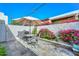 Outdoor patio with stone flooring, a table, and seating under a sun umbrella at 1216 E Ormondo Way, Phoenix, AZ 85014