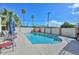 Community swimming pool surrounded by lush landscaping, perfect for relaxation at 1216 E Ormondo Way, Phoenix, AZ 85014