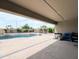 Inviting covered patio overlooking a sparkling pool, outdoor grill, and a charming pergola at 14703 W Hillside St, Goodyear, AZ 85395
