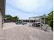 Large backyard featuring an in-ground pool, covered picnic table, and brick-paved patio at 14703 W Hillside St, Goodyear, AZ 85395