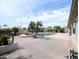 Expansive backyard features a pool, pergola, lounge area, and mature landscaping at 14703 W Hillside St, Goodyear, AZ 85395