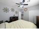 Bedroom features decorative wall art, and ceiling fan, providing a comfortable and stylish sleeping area at 14703 W Hillside St, Goodyear, AZ 85395
