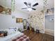 Bedroom featuring decorative wall coverings, a comfortable bed, and a ceiling fan at 14703 W Hillside St, Goodyear, AZ 85395