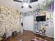 Bedroom featuring decorative wall coverings, a comfortable bed, and a ceiling fan at 14703 W Hillside St, Goodyear, AZ 85395