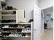 Well-organized closet featuring shoe racks and storage solutions for an efficient space at 14703 W Hillside St, Goodyear, AZ 85395