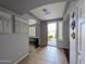 Inviting entryway featuring neutral paint, tile floors, and arched doorways leading to other rooms in the home at 14703 W Hillside St, Goodyear, AZ 85395