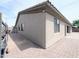 Exterior corner shot of home with walkway along the side and well maintained facade at 14703 W Hillside St, Goodyear, AZ 85395