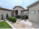 Lovely single-Gathering home with lush shrubs and plants adds to the curb appeal at 14703 W Hillside St, Goodyear, AZ 85395