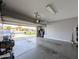 A spacious garage with gray walls and ample lighting, providing a clean and functional space at 14703 W Hillside St, Goodyear, AZ 85395