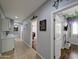 Hallway features tile floors, and connects to other rooms, enhancing flow and access throughout the home at 14703 W Hillside St, Goodyear, AZ 85395