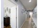 Hallway features tiled floors and doorways leading to other rooms, showcasing connectivity and interior access at 14703 W Hillside St, Goodyear, AZ 85395