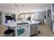 The kitchen features a large island, stainless steel appliances, and an open floorplan at 14703 W Hillside St, Goodyear, AZ 85395