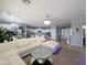 Spacious living area showcasing a modern white sectional, stylish coffee table, and open-concept design at 14703 W Hillside St, Goodyear, AZ 85395
