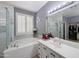 This main bathroom features a tub, a shower, and a double sink vanity at 14703 W Hillside St, Goodyear, AZ 85395