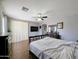 The main bedroom boasts lots of natural light and a ceiling fan at 14703 W Hillside St, Goodyear, AZ 85395